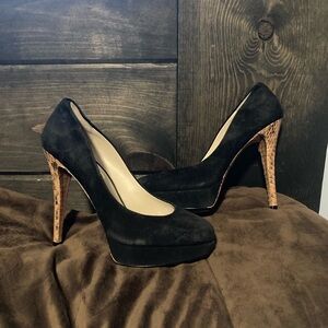 Michael Kors brand,size 7.5, black with a brown/tan snakeskin pattern high heels
